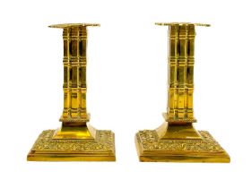 A pair of Victorian brass candlesticks by William Tonks & Sons.