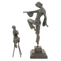 A reproduction bronze dancing figure.