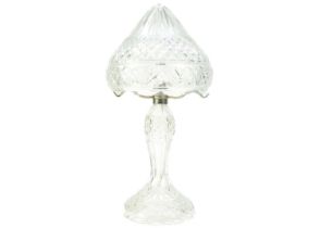 A cut glass table lamp and shade