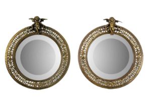 A pair of late 19th century circular brass frame table mirrors.