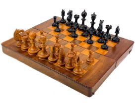 An ebony and boxwood Staunton pattern chess set.