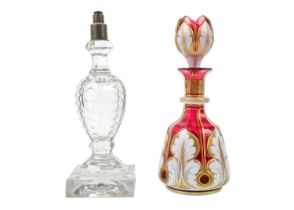 A Bohemian cranberry flash white overlay glass decanter and stopper.