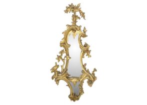 A carved gilt wood and gesso girandole mirror.
