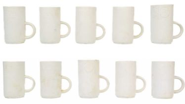 A set of eight Troika biscuit pottery coffee mugs.