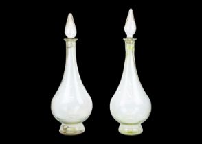 A pair of large modern apothecary display glass decanters and stoppers.