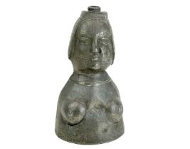 A female form baptisinal flask.