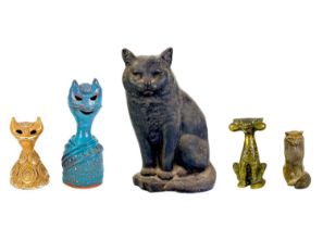 A bronze cat figurine.