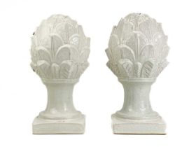 A pair of ceramic artichokes with crackle glaze finish.