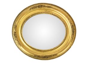 An Edwardian small oval gilt gesso wall mirror.