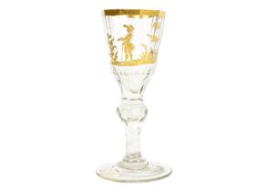 A Bohemian gilt decorated wine glass.