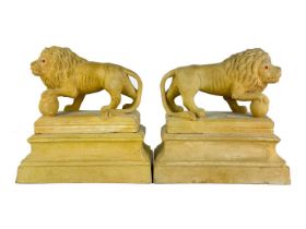 A pair of early 20th century terracotta Medici lions.