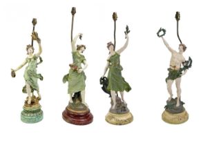 A pair of early 20th century painted spelter table lamps.