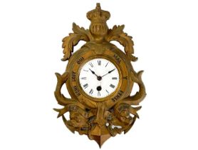 A late 19th century nautical themed cast metal wall clock.