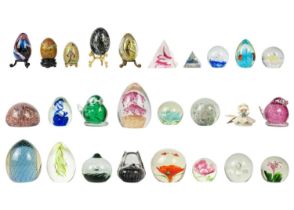 A collection of glass paper weights.