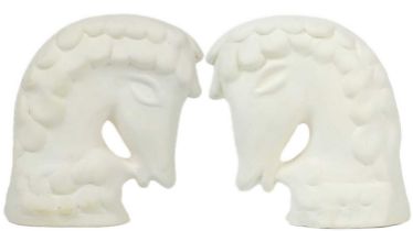 A pair of biscuit pottery horse heads probably by Eric Leaper.