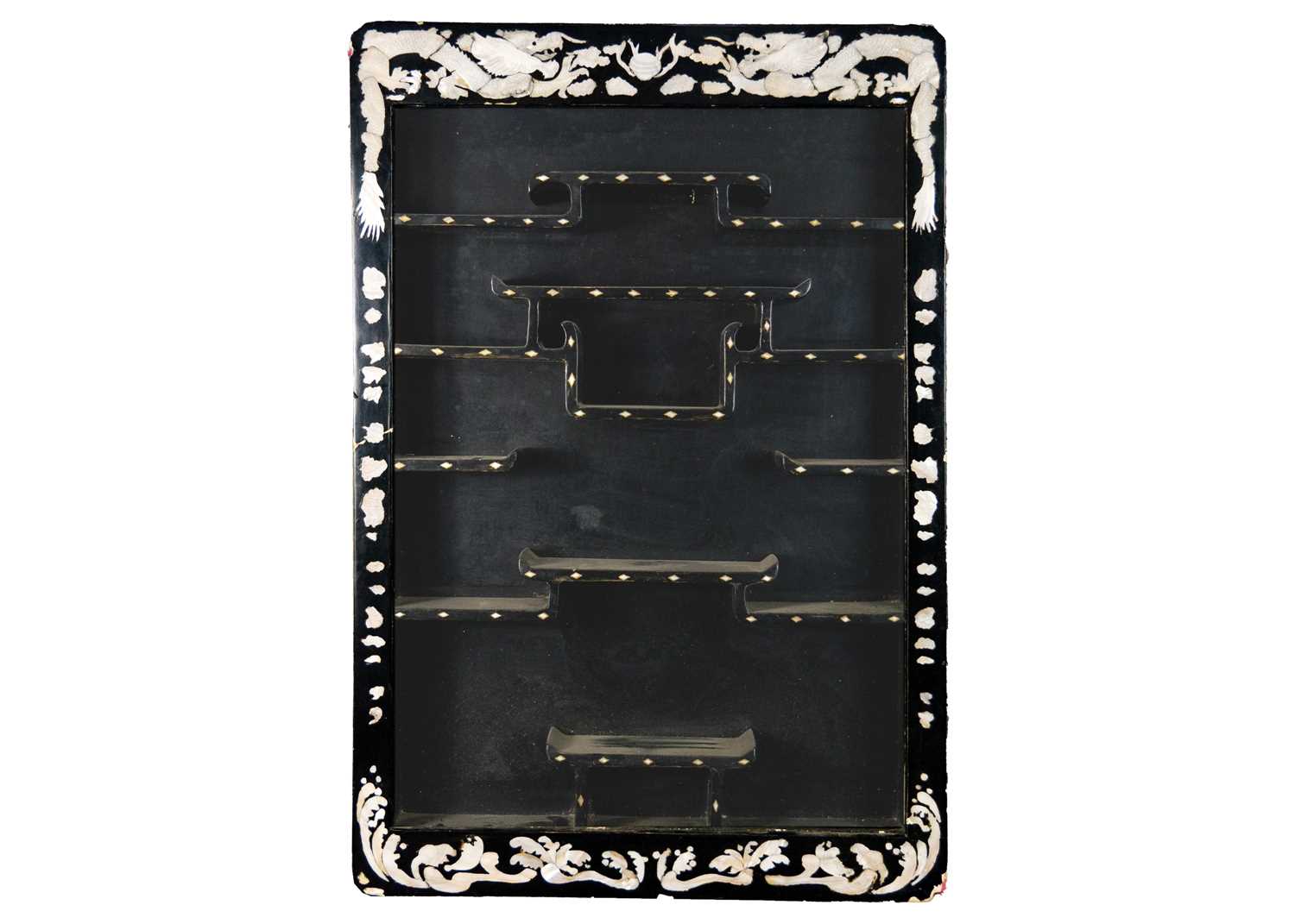A Chinese black lacquer and mother-of-pearl hanging display cabinet.