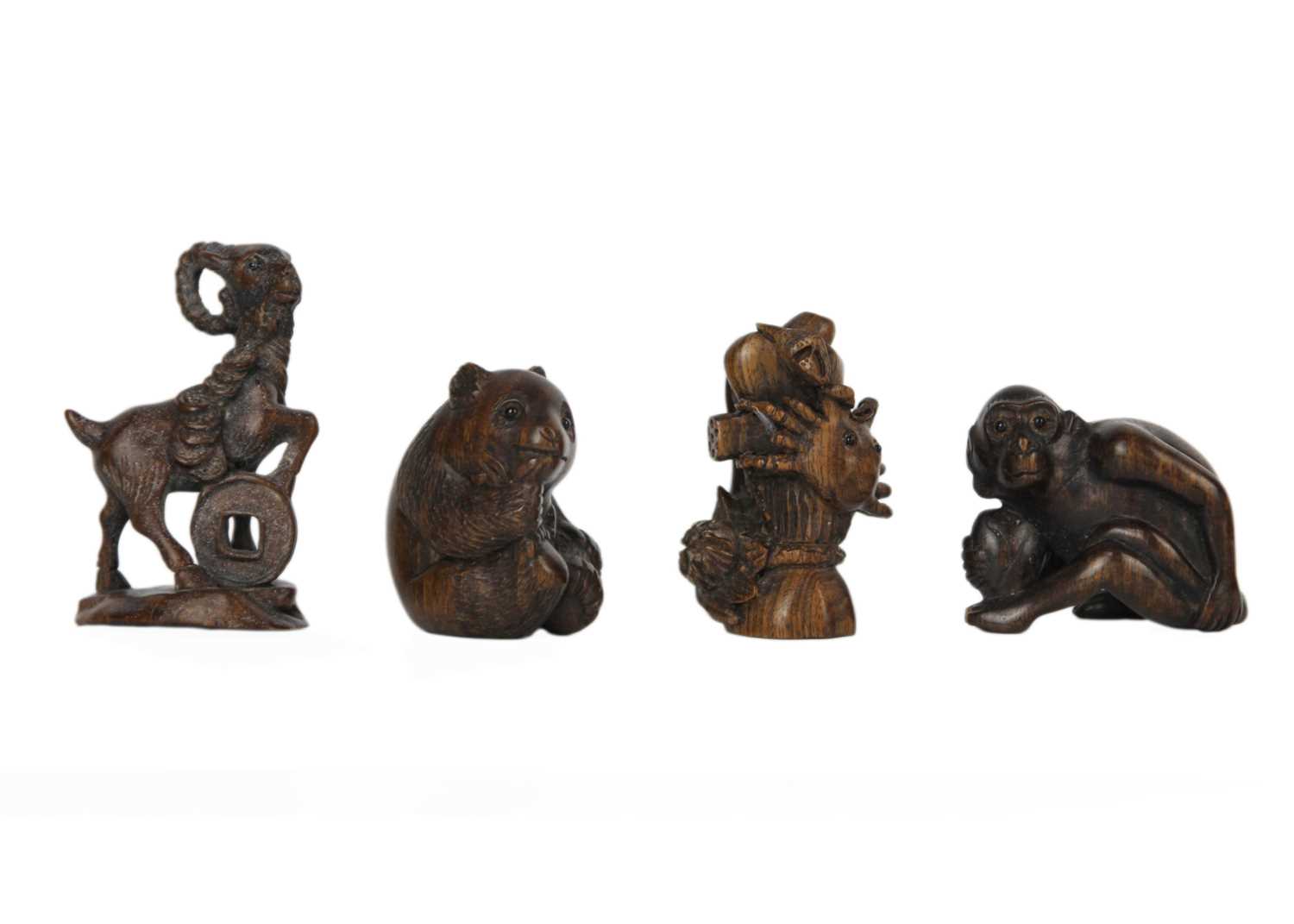 A collection of eleven Japanese carved wood netsukes, 20th century. - Image 2 of 5