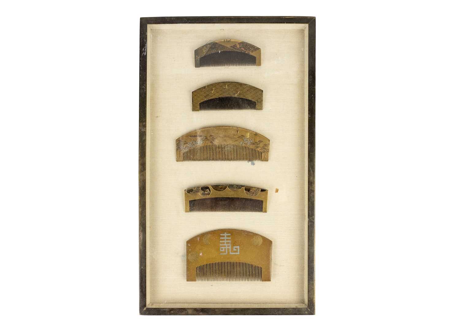 A collection of five Japanese gold lacquer combs, Meiji period.