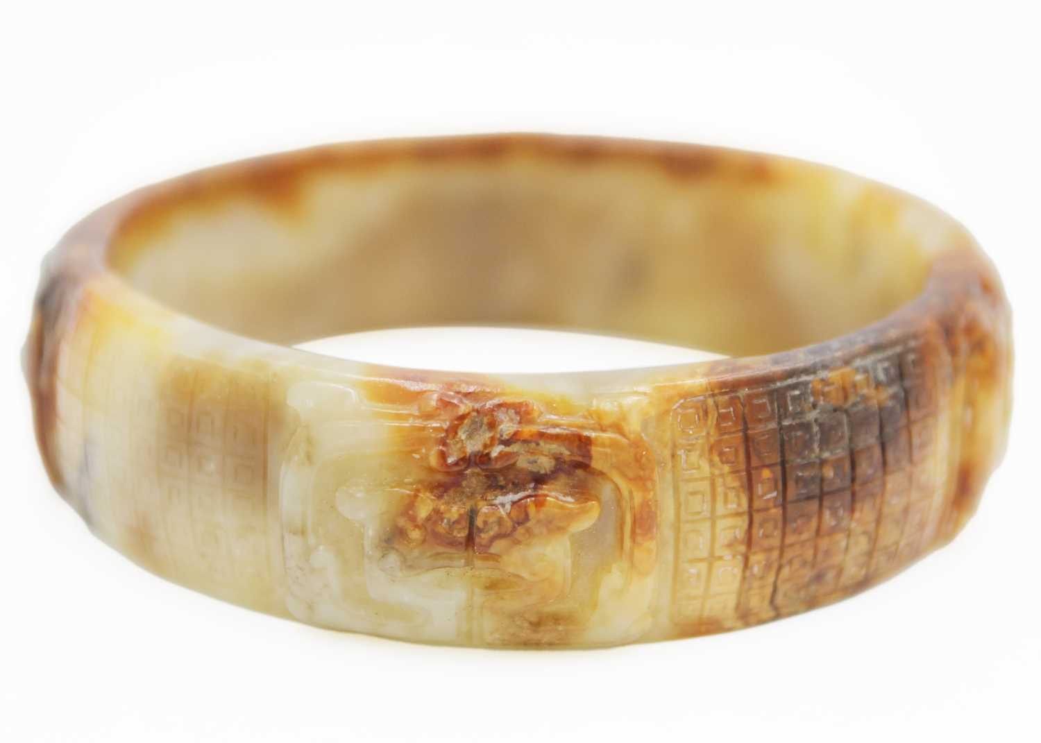 A Chinese carved jade bangle, probably Neolithic period.