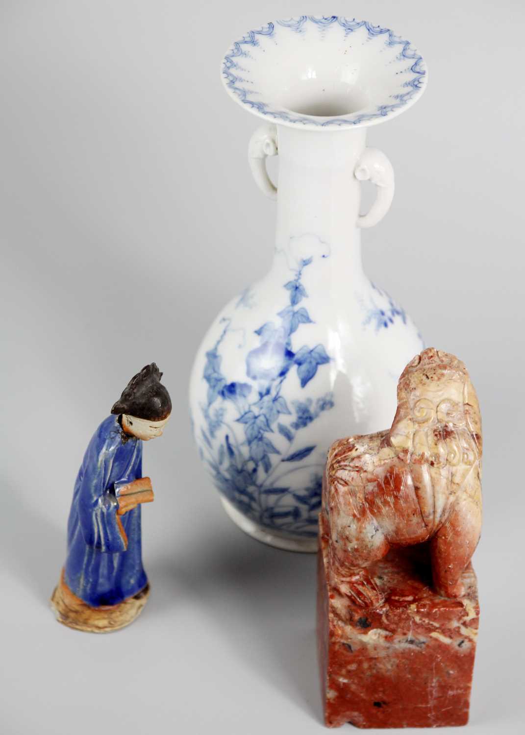 A Chinese blue glazed pottery figure of a tomb attendant holding a scroll. - Image 4 of 7