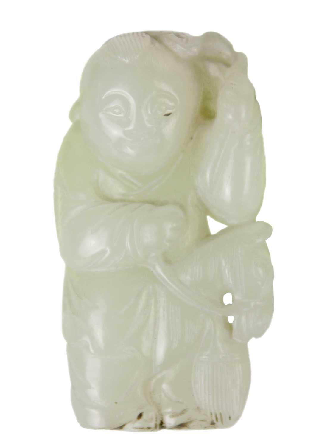 A Chinese celadon jade figure of a boy with hobby horse, Qing Dynasty, 19th century.