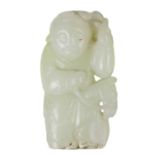 A Chinese celadon jade figure of a boy with hobby horse, Qing Dynasty, 19th century.