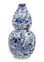 A Chinese blue and white porcelain double gourd vase, circa 1900.