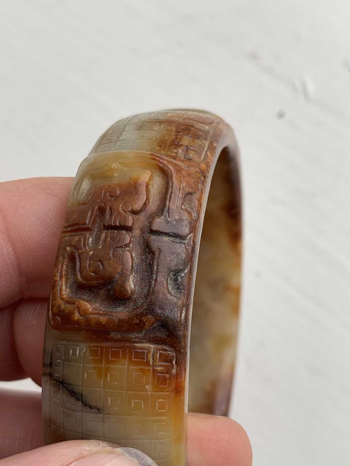 A Chinese carved jade bangle, probably Neolithic period. - Image 24 of 30