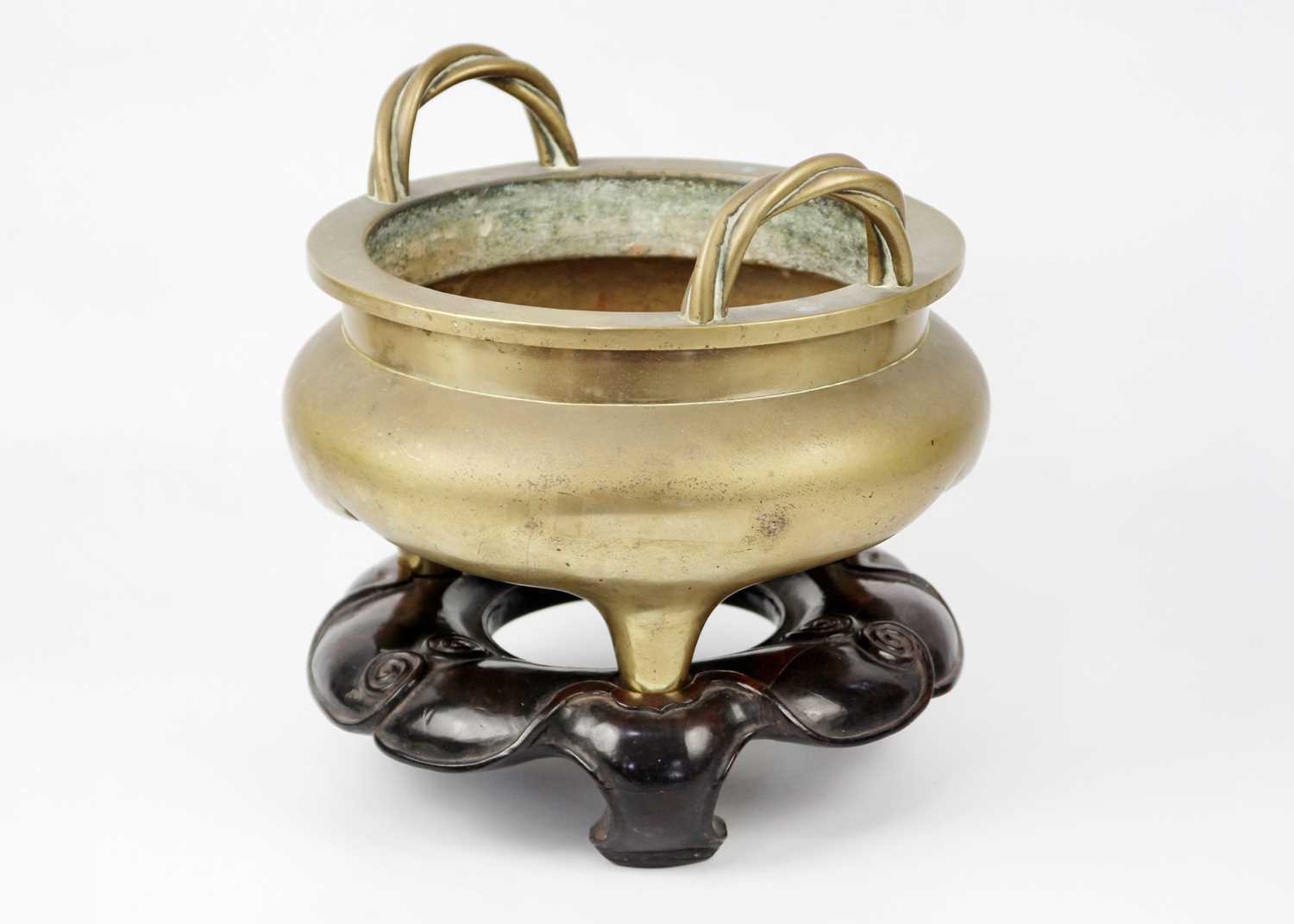 A large Chinese bronze twin-handled tripod censer on stand, Qing Dynasty. - Image 9 of 29