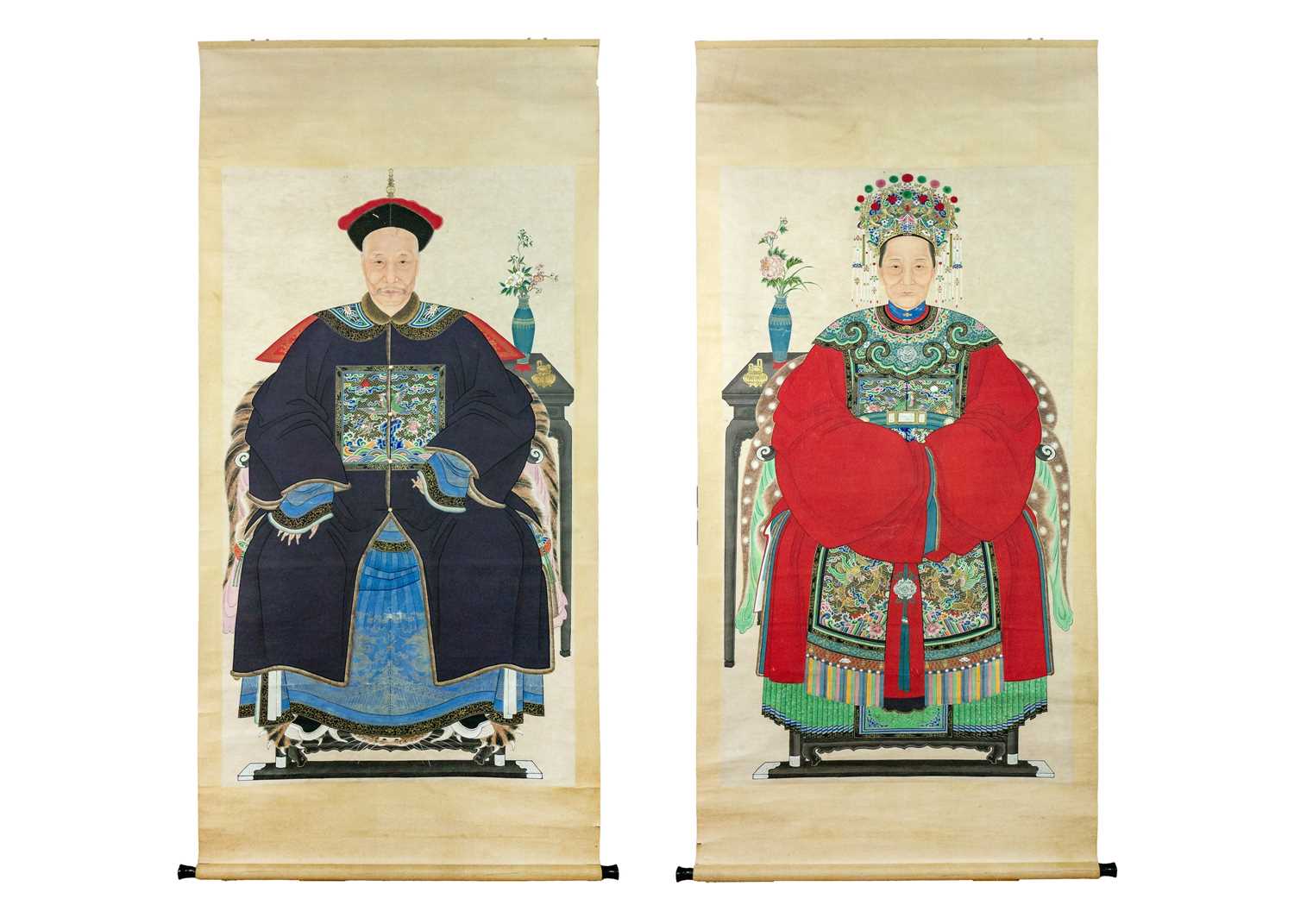 A large pair of Chinese ancestor portrait scroll paintings, late 19th/early 20th century.