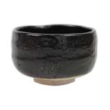 A Japanese raku-yaki ware chawan, signed, Showa period.