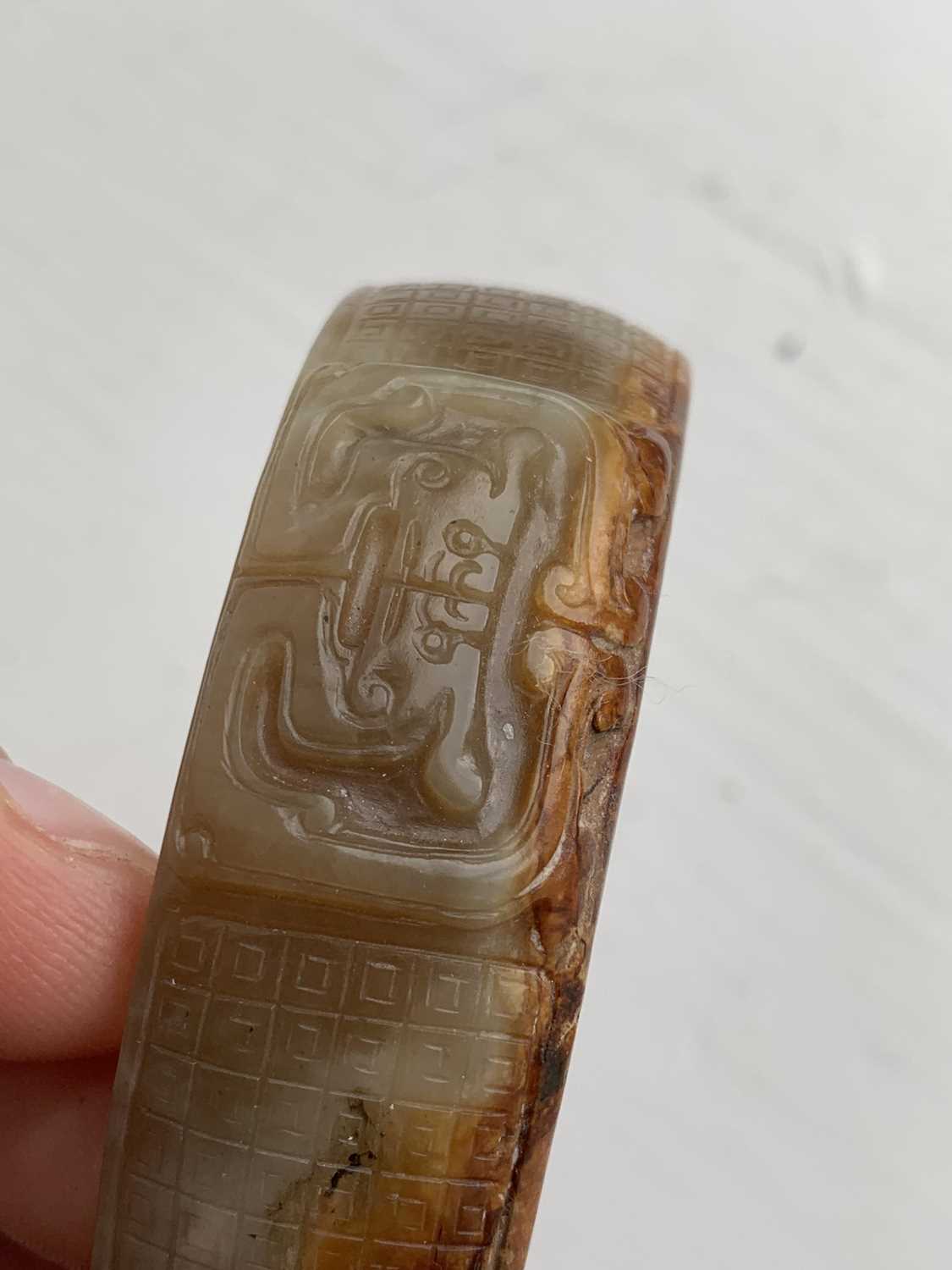 A Chinese carved jade bangle, probably Neolithic period. - Image 23 of 30