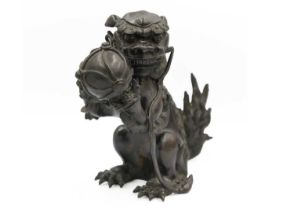 A Chinese bronze 'lion dog' incense burner, Qing Dynasty, 19th century.
