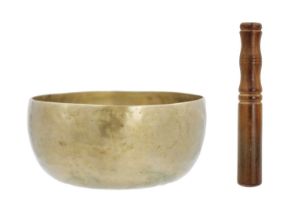 A Tibetan polished bronze singing bowl.
