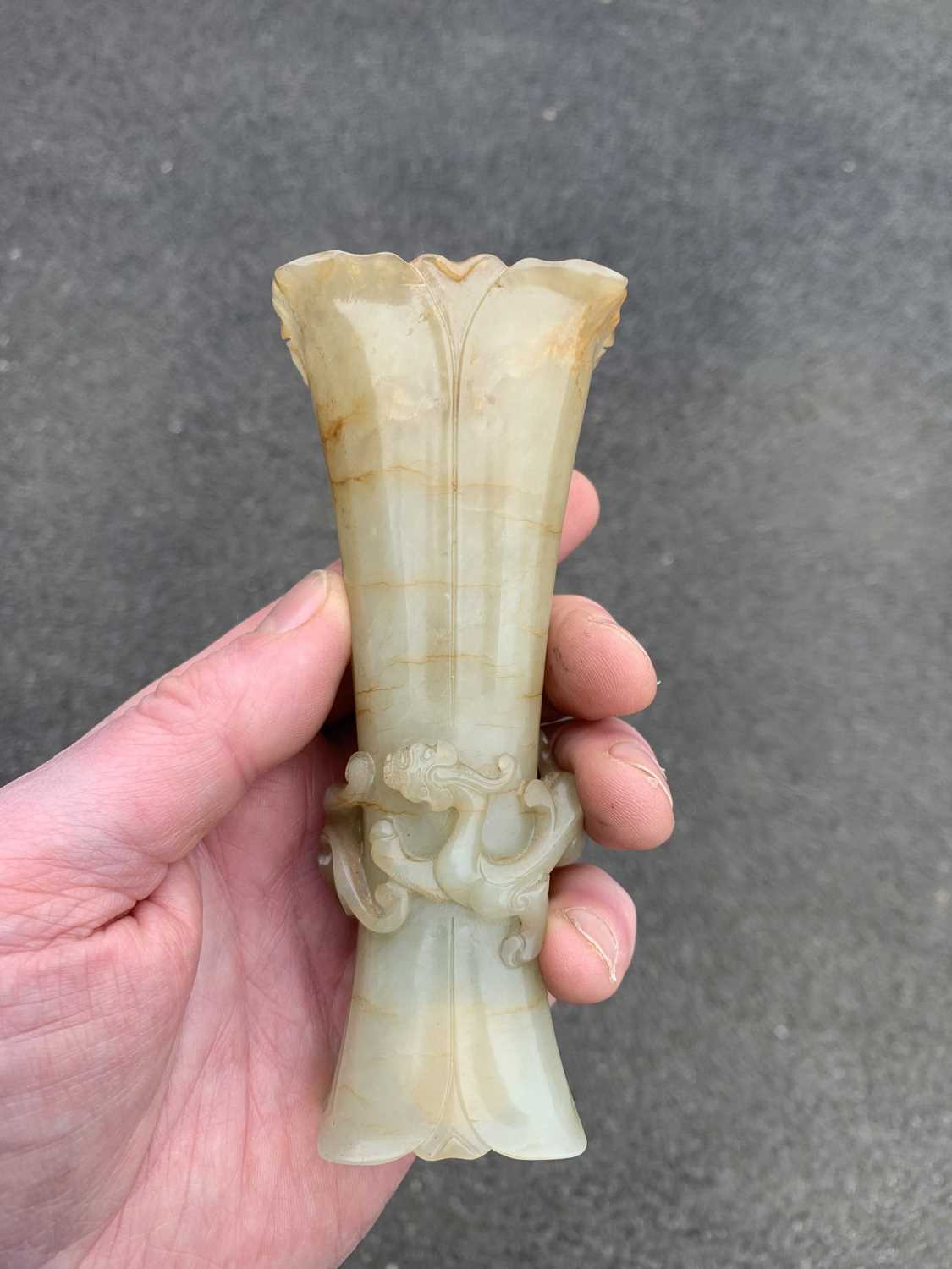 A Chinese pale green jade Gu vase, early Qing Dynasty. - Image 15 of 25