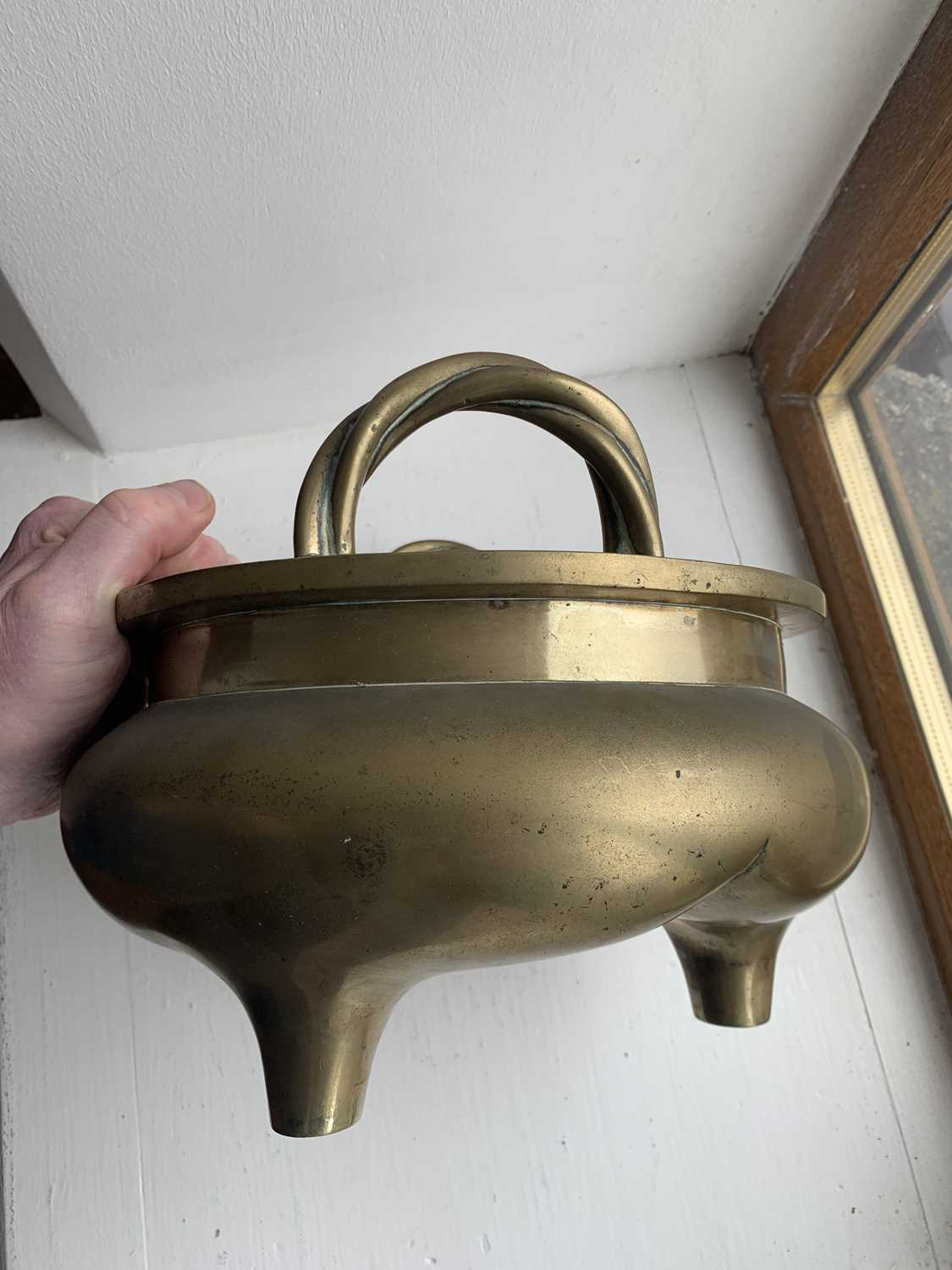 A large Chinese bronze twin-handled tripod censer on stand, Qing Dynasty. - Image 21 of 29