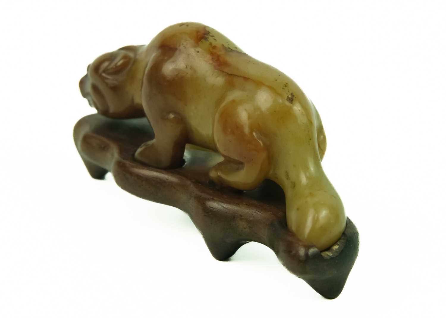 A Chinese russet jade tiger, Qing Dynasty, 19th century. - Image 2 of 25