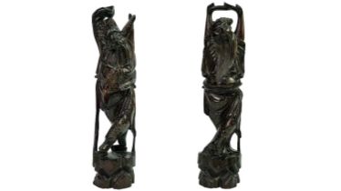 A pair of Chinese inlaid hardwood figures of immortals, late 19th century.