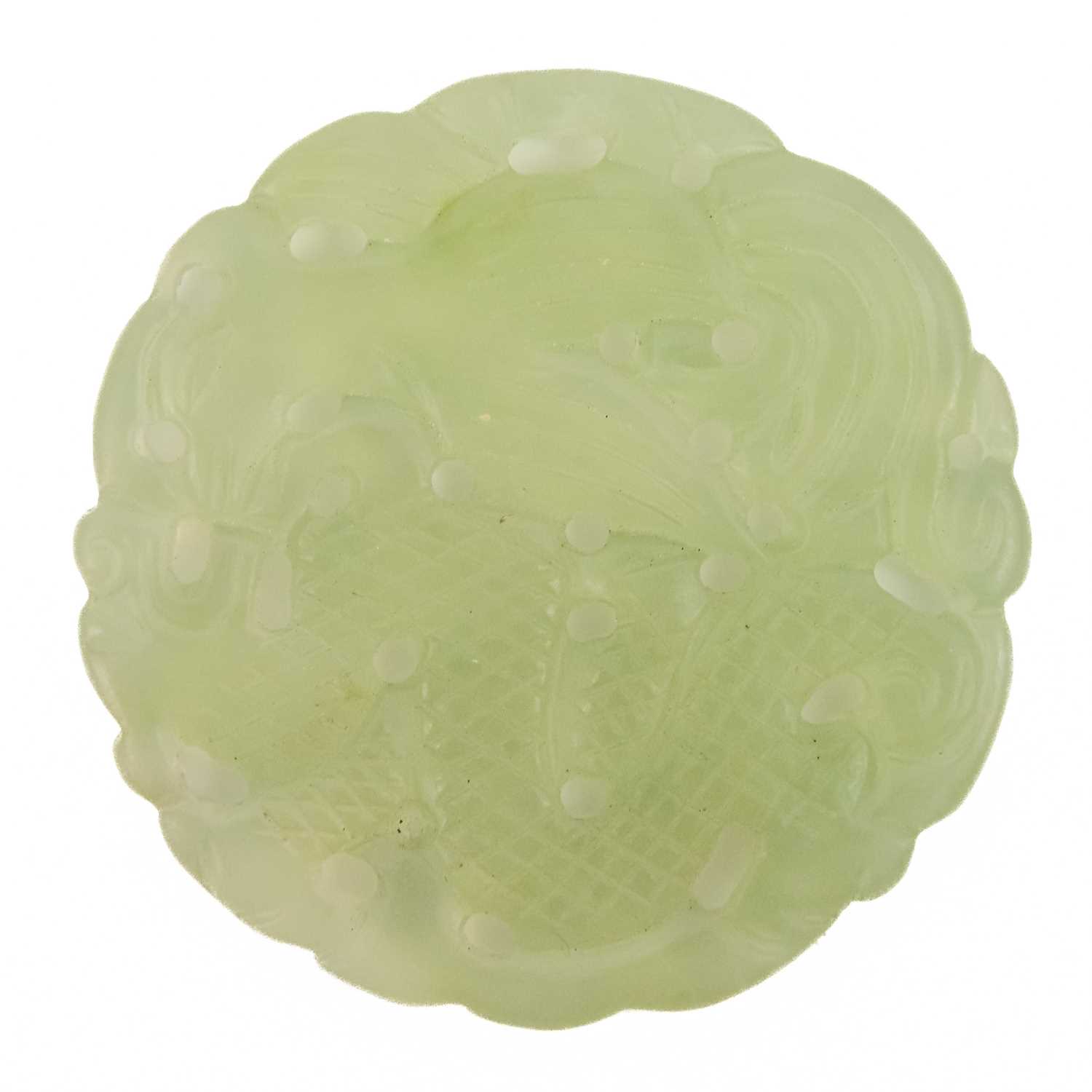 A Chinese carved jade roundel.