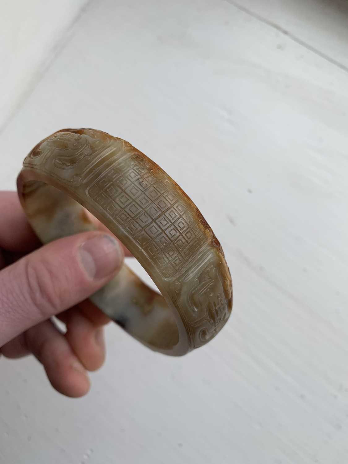 A Chinese carved jade bangle, probably Neolithic period. - Image 7 of 30