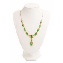 An Art Nouveau jade and 14ct mounted necklace, with enclosed back and stamped 14k.