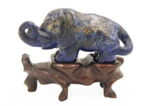 A Chinese lapis lazuli model of an elephant on stand, Qing Dynasty, 19th century.