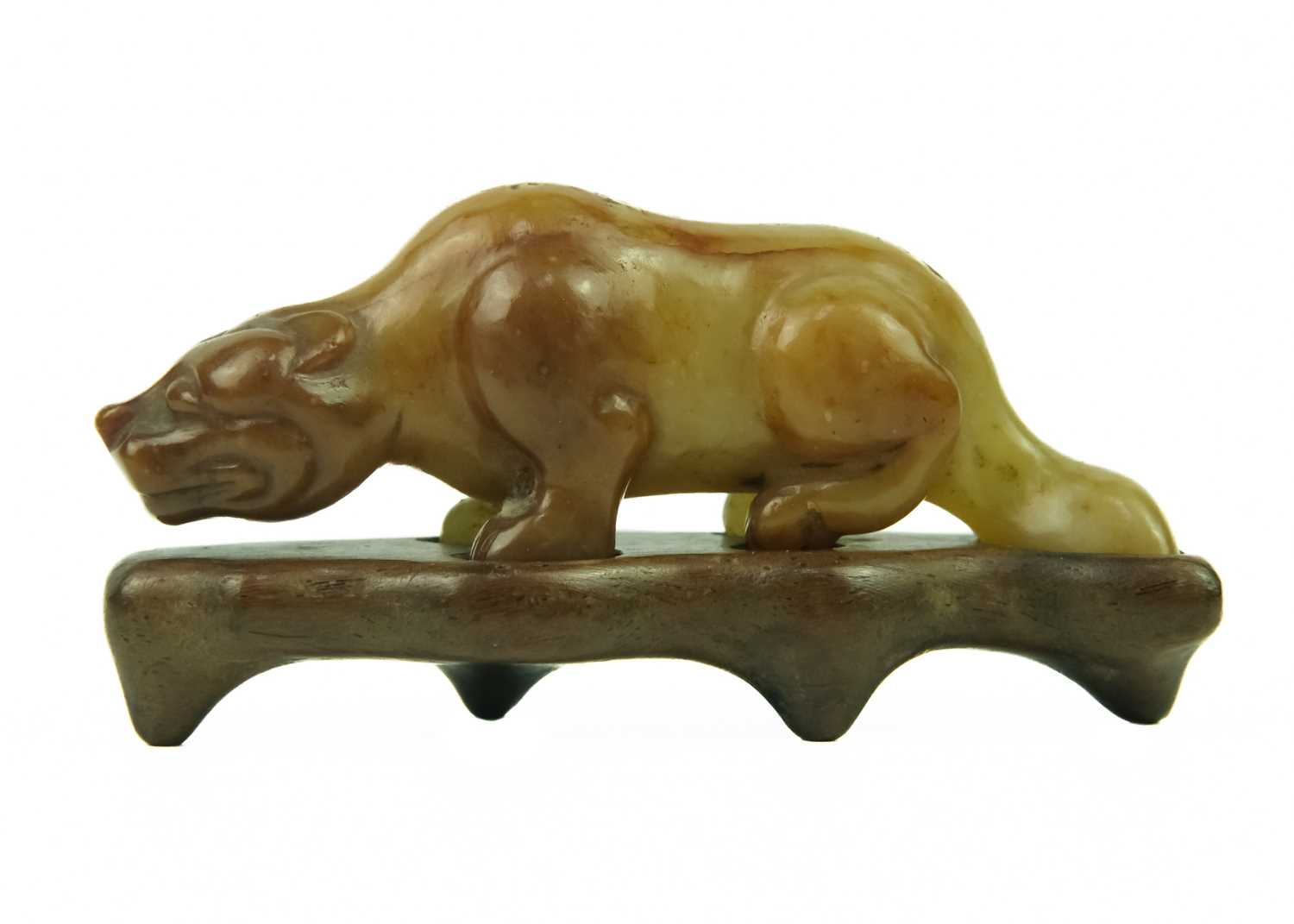 A Chinese russet jade tiger, Qing Dynasty, 19th century.