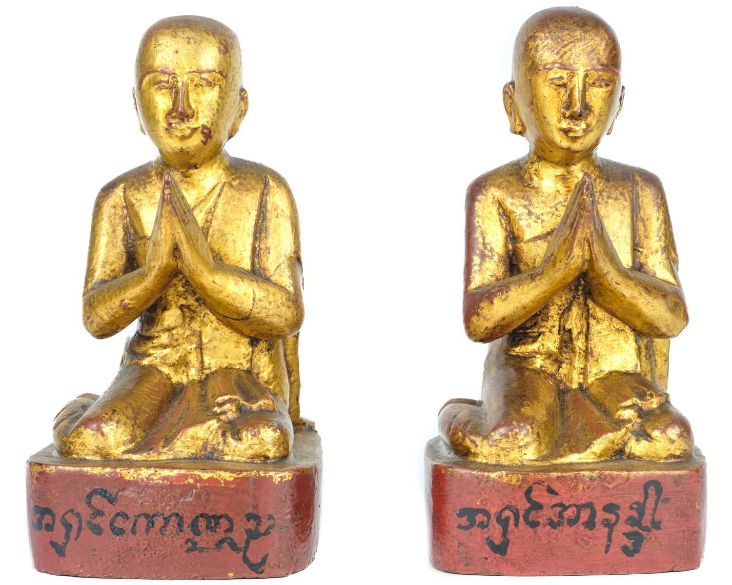 Two Burmese gilt wood models of monks, 19th century.