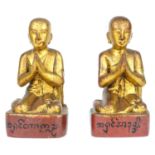 Two Burmese gilt wood models of monks, 19th century.