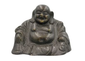 A Chinese bronze model of a seated Buddha, 18th/19th century.