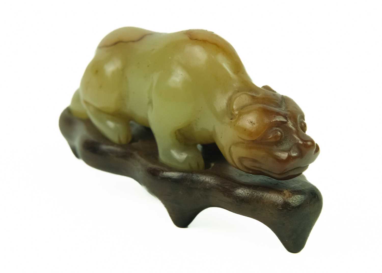 A Chinese russet jade tiger, Qing Dynasty, 19th century. - Image 4 of 25