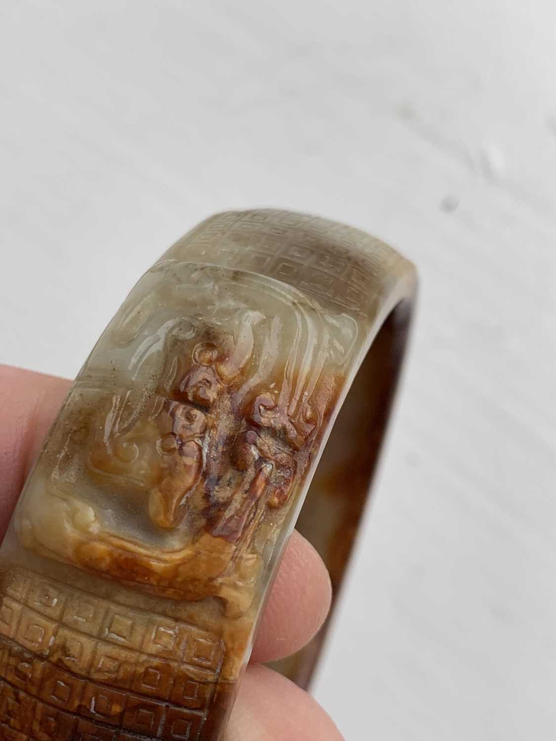 A Chinese carved jade bangle, probably Neolithic period. - Image 27 of 30