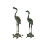 A pair of Japanese bronze figures of storks, Meiji period.