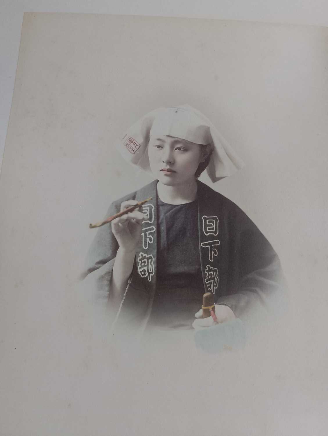 A Japanese hand coloured photo album with lacquer cover, Meiji period. - Image 41 of 52